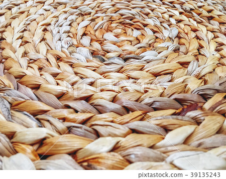 Close up photo of surface made of woven straw. Close up photo of surface made of woven straw. 39135243