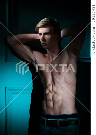 Young Handsome man portrait at dark background Young Handsome man portrait at dark background 39135451