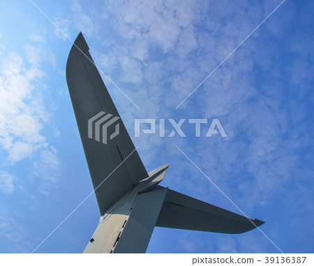 Tail of an aircraft against blue sky Tail of an aircraft against blue sky 39136387