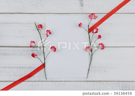 Blank white card decorate with red paper flowers Blank white card decorate with red paper flowers 39136459