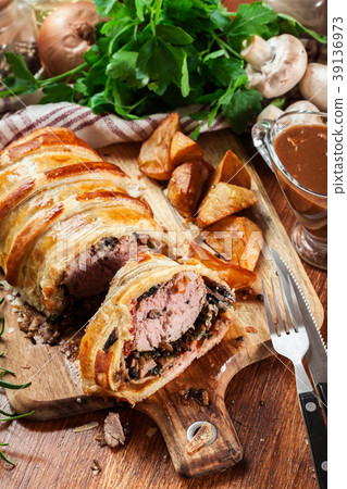 Pork tenderloin in wellington style in puff pastry Pork tenderloin in wellington style in puff pastry 39136973