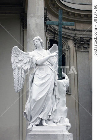 Angel statue with cross, Karlskirche in Vienna Angel statue with cross, Karlskirche in Vienna 39137560