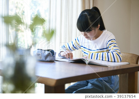 Girl studying at the window Girl studying at the window 39137654