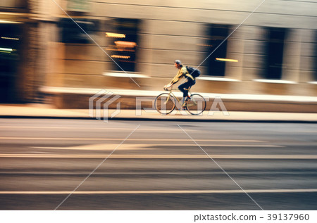 Motion blur. Male cycling bicycle Motion blur. Male cycling bicycle 39137960