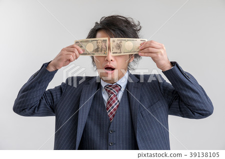 A man in a suit with a huge appeal for money 39138105