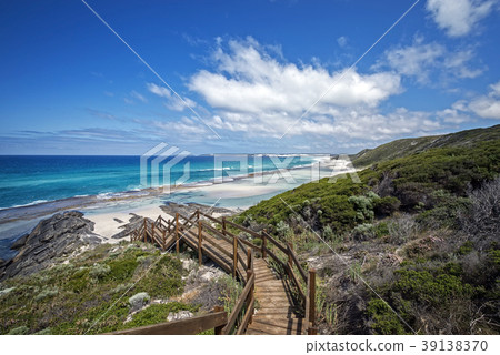 rough costline with stairway to the beach 39138370