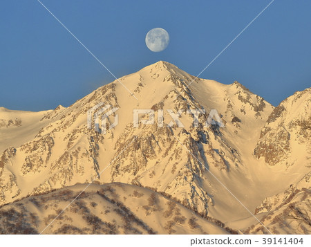 Northern Alps and the Moon in the morning sun 39141404