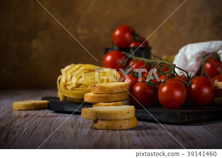 Red cherry tomatoes on vintage wooden table Red cherry tomatoes on vintage wooden table 39141460
