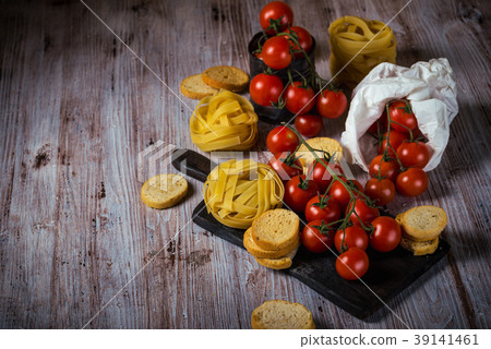 Red cherry tomatoes on wooden table Red cherry tomatoes on wooden table 39141461