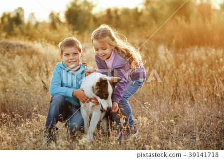 Family. Brother, sister and dog. 39141718