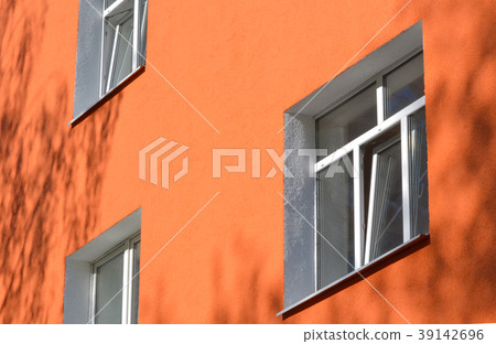 Facade building with pink walls Facade building with pink walls 39142696