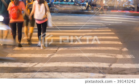 Blurred motion of cars and people on the Blurred motion of cars and people on the 39143242
