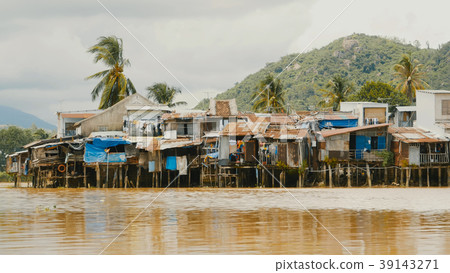 Slums in Nha Trang. Houses on the river. Vietnam. Slums in Nha Trang. Houses on the river. Vietnam. 39143271