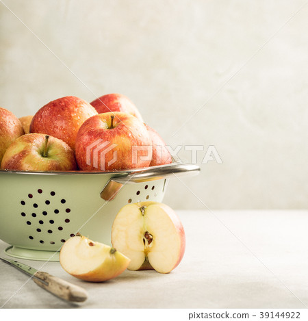 Fresh apples in metal strainer 39144922