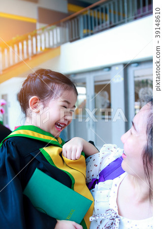 Kindergarten graduation. mom and child smiling. Kindergarten graduation. mom and child smiling. 39148610