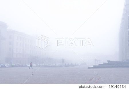 The central city square in the morning fog. 39149384