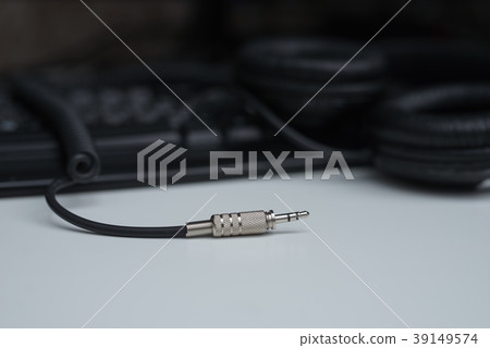 Metal plug of professional headphones on white 39149574