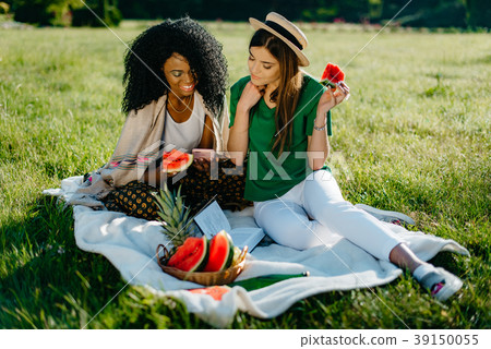 Outdoor portrait of two cheerful smiling pretty 39150055