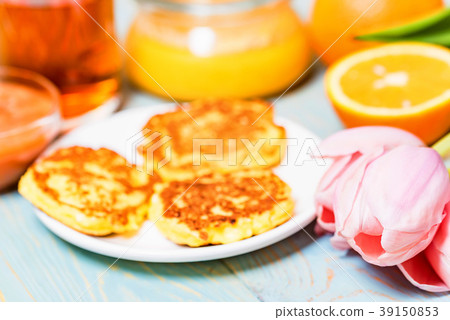 Cottage cheese cakes, honey, quince jam, flower 39150853
