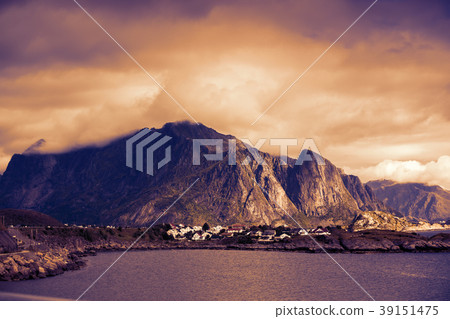 Rocky seashore with cloudy sky at sunset Rocky seashore with cloudy sky at sunset 39151475