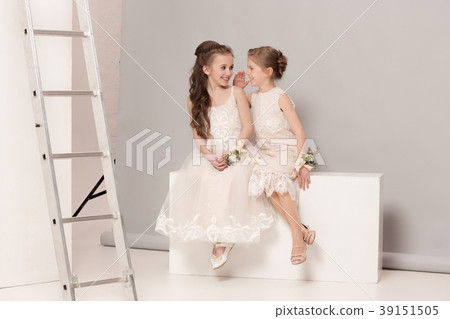 Little pretty girls with flowers dressed in Little pretty girls with flowers dressed in 39151505