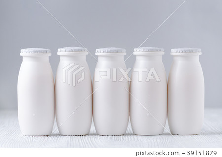 five bottles of drink yogurt on gray background five bottles of drink yogurt on gray background 39151879