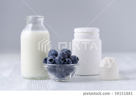 milk products and blueberrys on the table milk products and blueberrys on the table 39151881