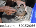 closeup on potter man hands shaping ceramic craft, 39152066