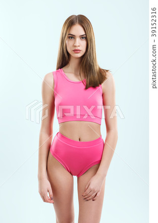 Young attractive woman in swimsuit posing in studio Young attractive woman in swimsuit posing in studio 39152316