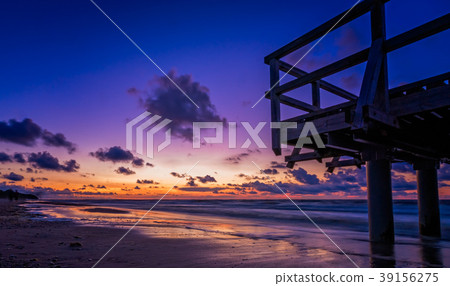 Sunset over wooden pier on the sea beach 39156275