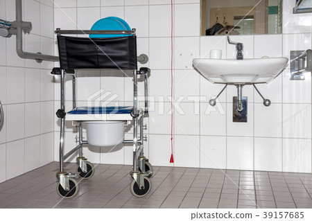 Wheelchair with included toilet pan in retirement 39157685