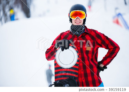Image of standing athlete with snowboard in winter 39159119