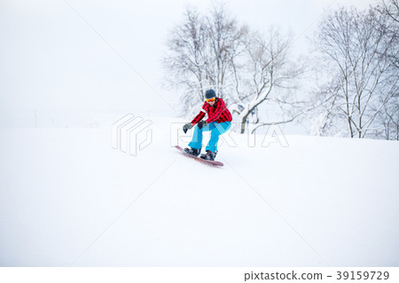 Image of snowboarder man jumping on snowy hill Image of snowboarder man jumping on snowy hill 39159729