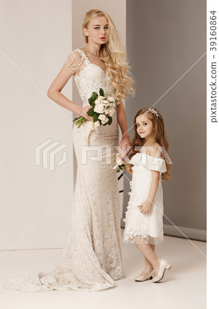 Little pretty girls with flowers dressed in Little pretty girls with flowers dressed in 39160864
