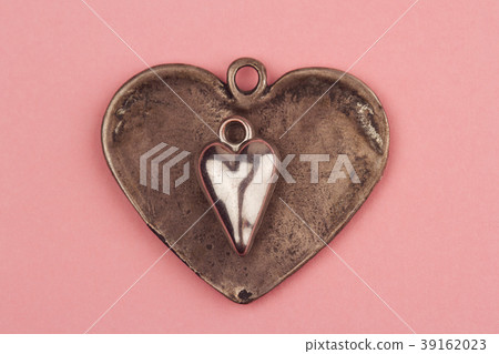 two vintage heart shaped jewels on top of other two vintage heart shaped jewels on top of other 39162023