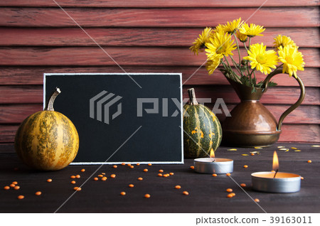 Black board, pumpkin and copper jug 39163011