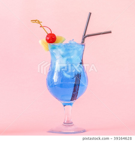 Blue Curacao cocktail decorated with fruit. 39164628