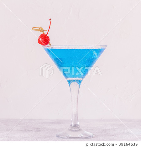 Blue Curacao cocktail decorated with fruit. 39164639