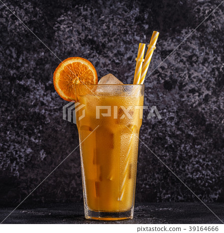 Cocktail with orange juice and ice cubes 39164666
