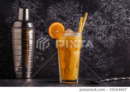 Cocktail with orange juice and ice cubes 39164667