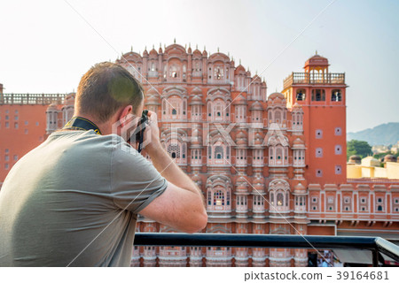 Male traveler takes picture of Hawa Mahal in India Male traveler takes picture of Hawa Mahal in India 39164681