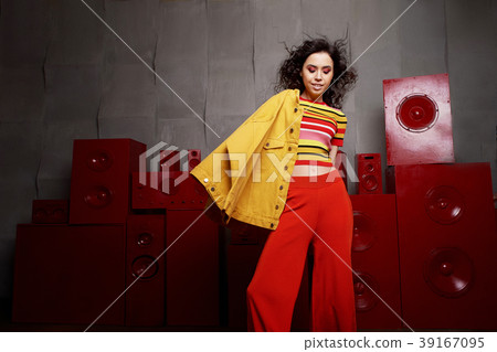 Studio fashion shooting. The girl in a bright Studio fashion shooting. The girl in a bright 39167095