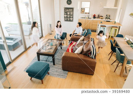 Family of four of young couple and primary schoolchild two sisters 39169480