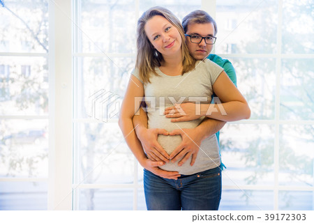 Beautiful couple: pregnant woman and man Beautiful couple: pregnant woman and man 39172303