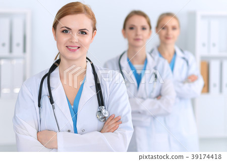 Beautiful female medical doctor standing at Beautiful female medical doctor standing at 39174418