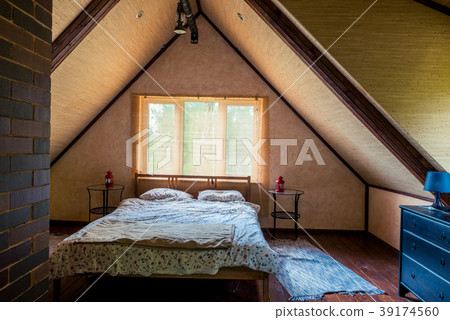 interior of a room with a bed on the top floor 39174560