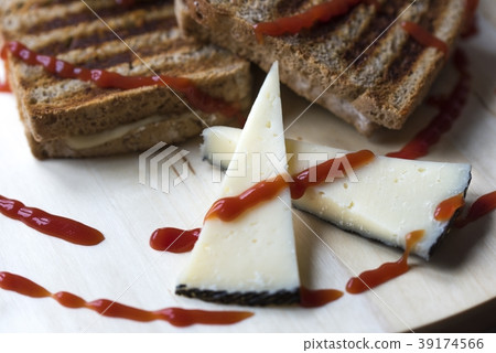 Toasted bread with cheese and ketchup Toasted bread with cheese and ketchup 39174566