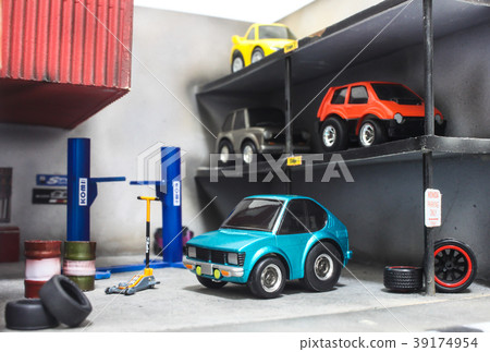 Blue model toy car in custom car shop scene 39174954
