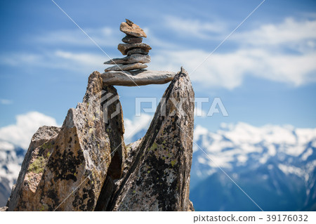 Stones cairn bridging gap near Eggishorn, Alps 39176032