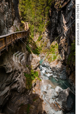 Vertical shot of path in Gorner Gorge with river 39176041